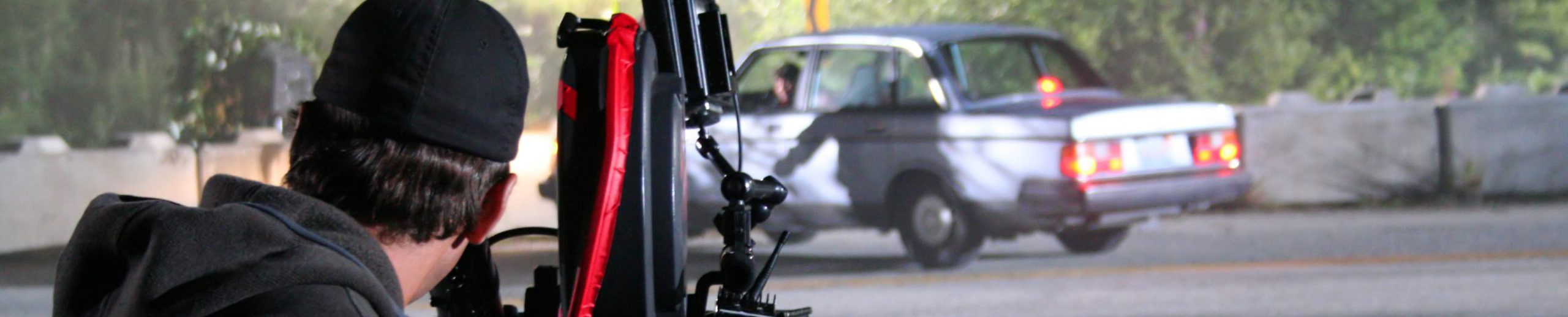 A cameraman captures a car crash during filming of a tv miniseries.