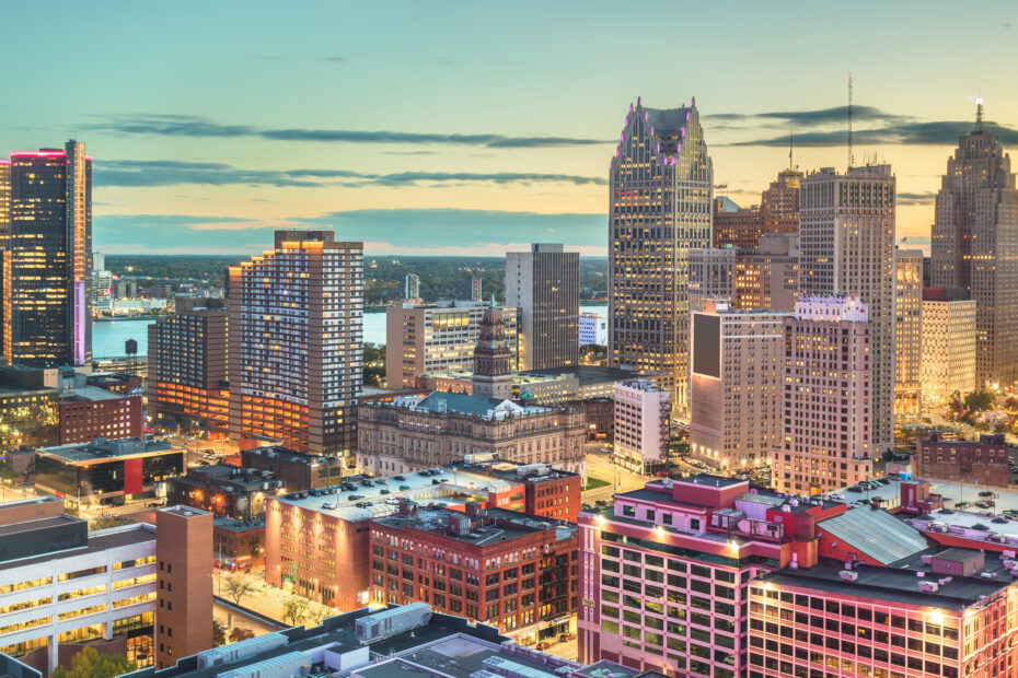 Detroit downtown skyline with Renaissance Center towers and historic buildings at dusk