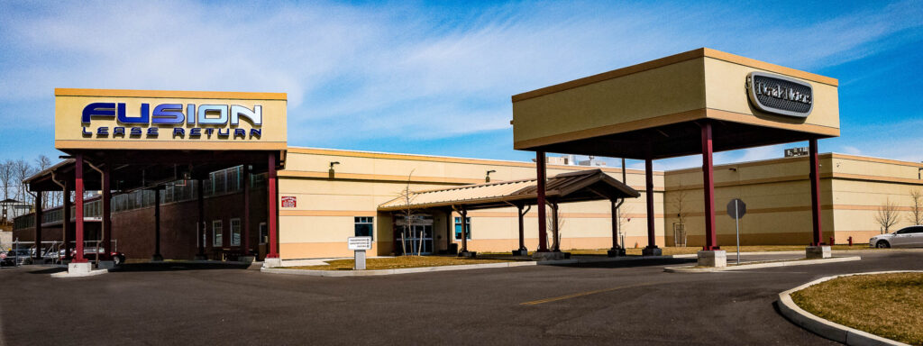 Fusion Lease Return building exterior with drive-up canopy and signage